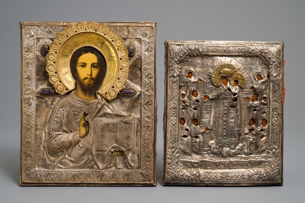 Two Russian silvered copper oklad or riza icons: 'Mother of God with apostles' and 'Pantocrator', 19th C.