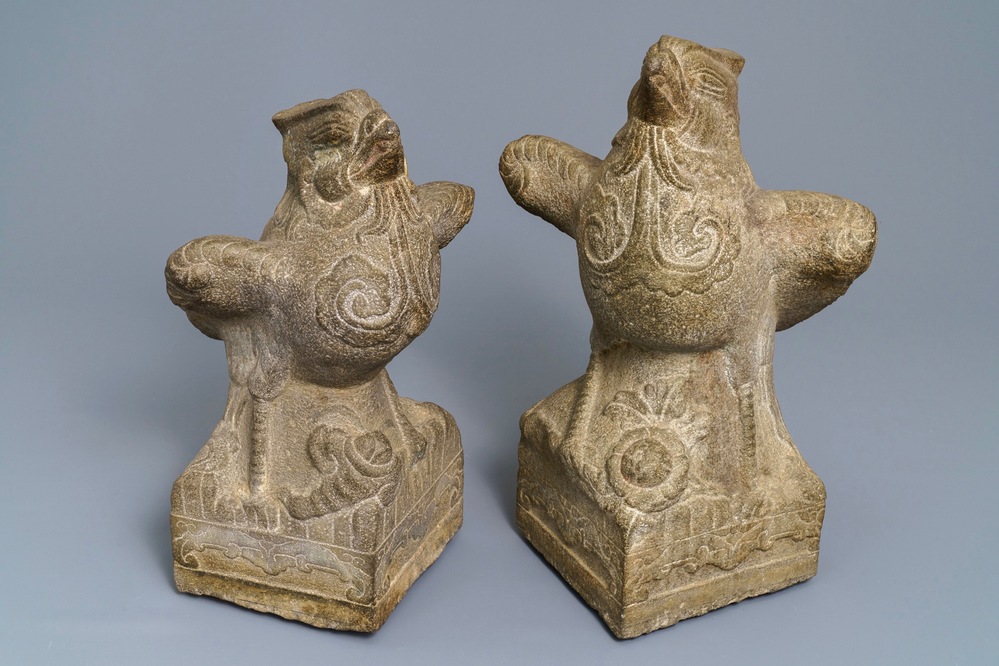 A pair of large Chinese carved stone 'phoenix' figures, Yuan or Ming