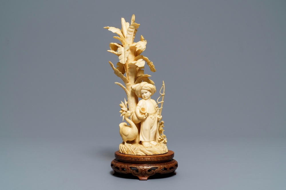 A Chinese carved ivory figure of a boy with fishing rod, ca. 1940