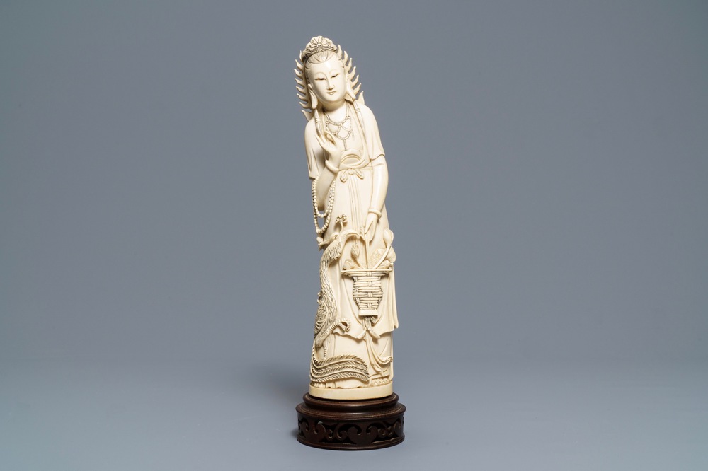 A Chinese ivory figure of Guanyin with a phoenix, ca. 1900