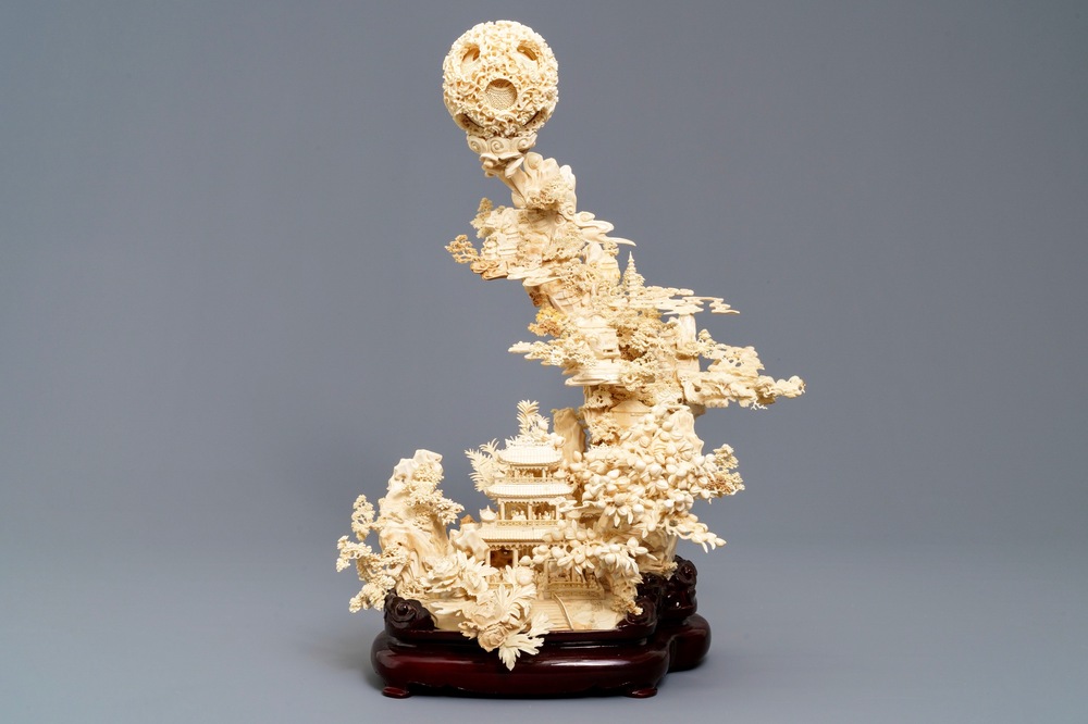 A fine Chinese ivory landscape with a puzzle ball, Canton, ca. 1920