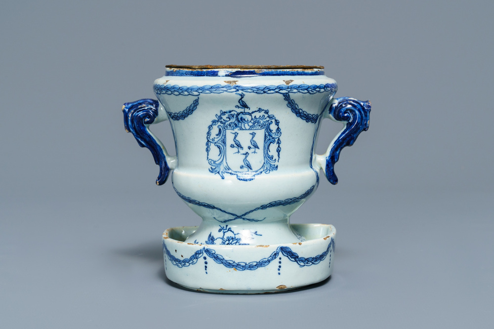 A Dutch Delft blue and white armorial 'campana' vase on stand, 18th C.