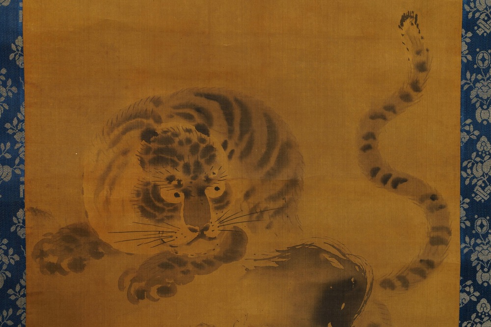 Japanese school, 18/19th C., after Kano Masanobu, ink on silk: A tiger on a rock