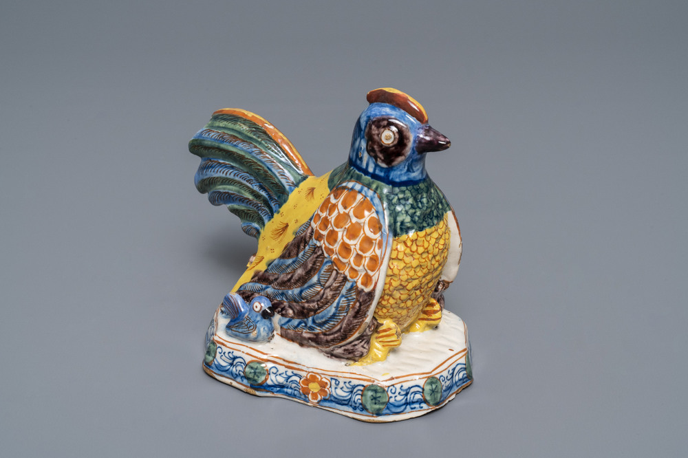 A polychrome Dutch Delft group of a hen with chickens, 18th C.