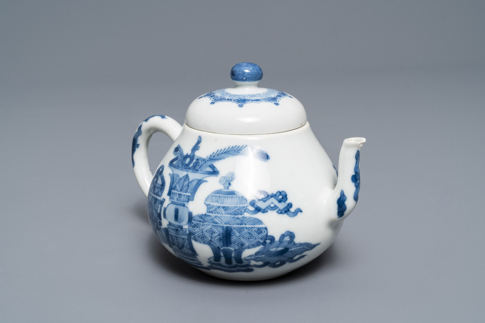 A Chinese blue and white teapot and cover with antiquities, Jiajing mark, Kangxi