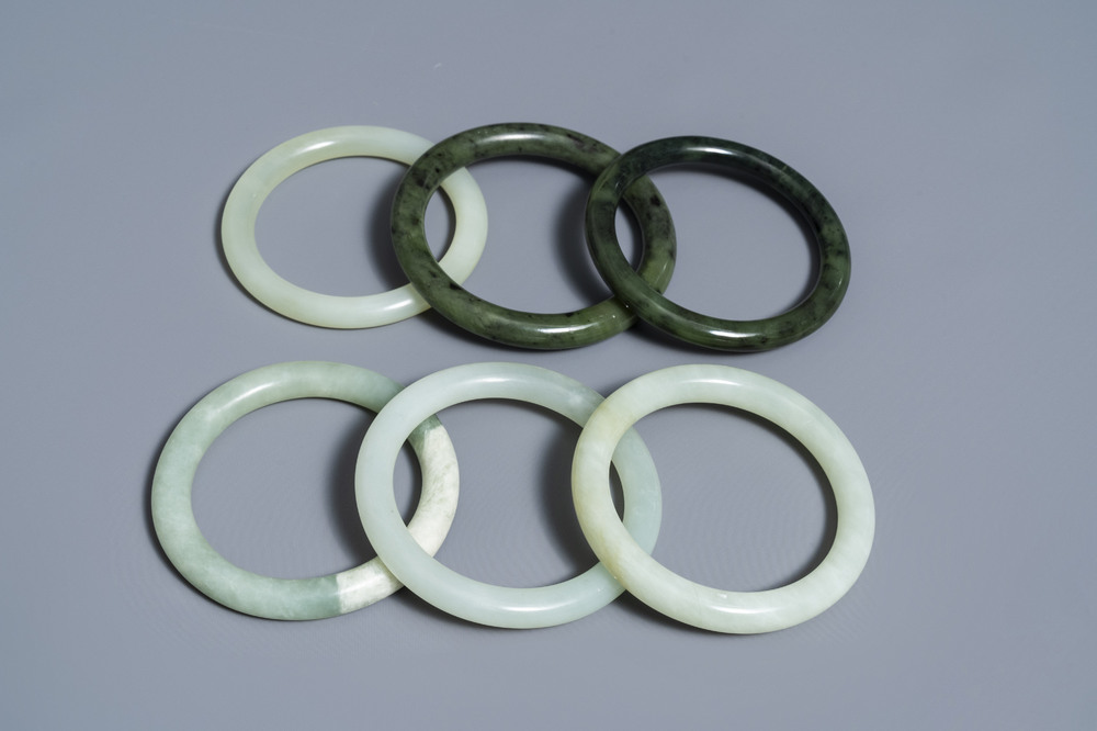 Six Chinese celadon and spinach green jade bangles, 19/20th C.