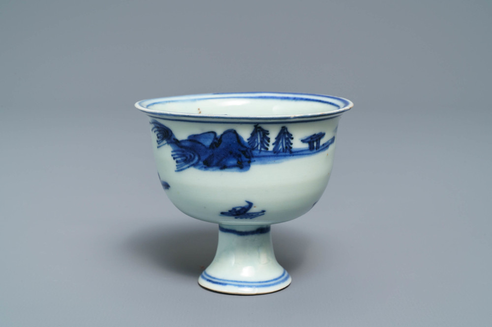 A Chinese blue and white stem cup with landscape design, Transitional period