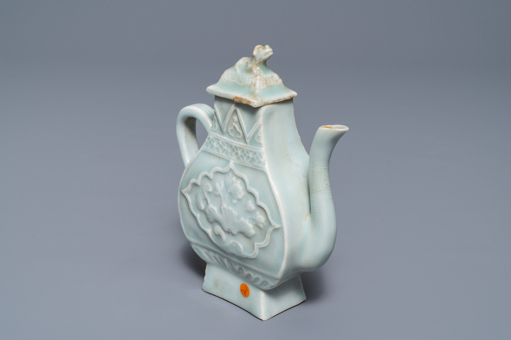 A Chinese qingbai relief-decorated 'phoenix' ewer and cover, Yuan