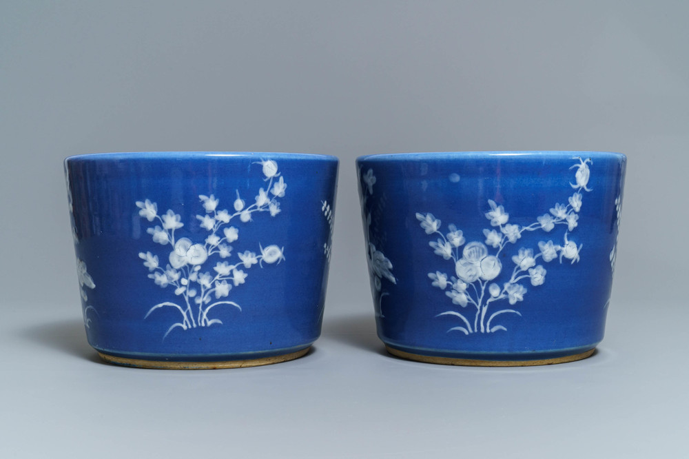 A pair of Chinese blue-ground slip-decorated jardini&egrave;res, 19th C.