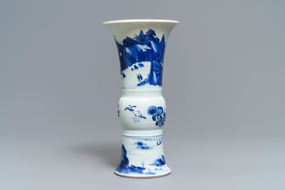 Een Chinese blauw-witte gu vaas met landschapsdecor, Kangxi merk en periode