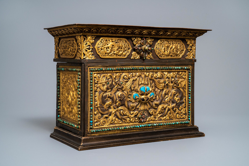 A turquoise-inlaid gilt bronze and copper repouss&eacute; 'tepchog' folding altar table, Tibet, 19th C.