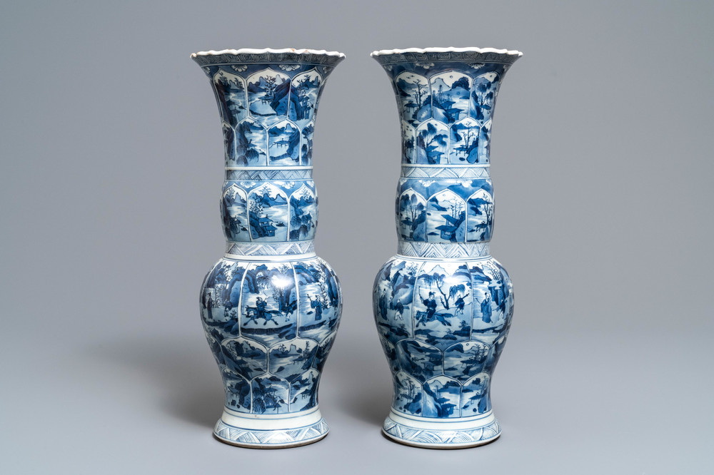 A pair of Chinese blue and white yenyen vases with figures in landscapes, Kangxi