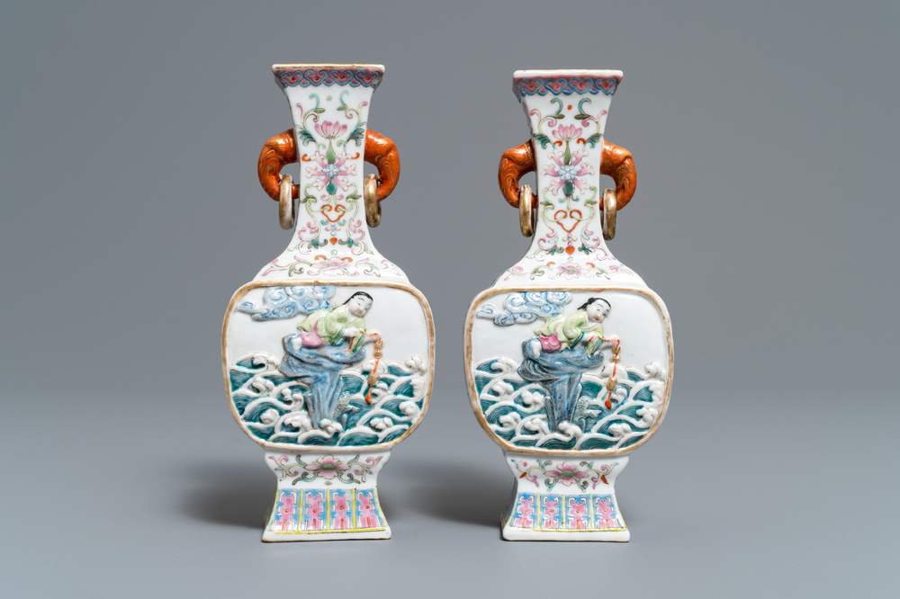 A pair of Chinese famille rose relief-decorated 'Liu Hai' vases, Qianlong mark, 19th C.