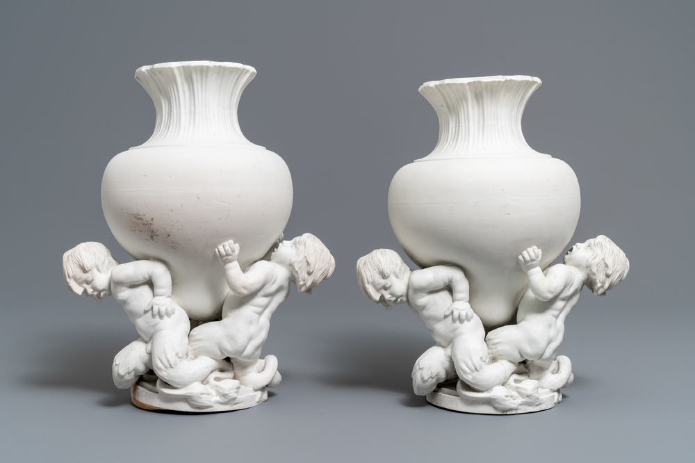 A pair of biscuit vases with young tritons, Saint-Amand or Tournai, 18th C.