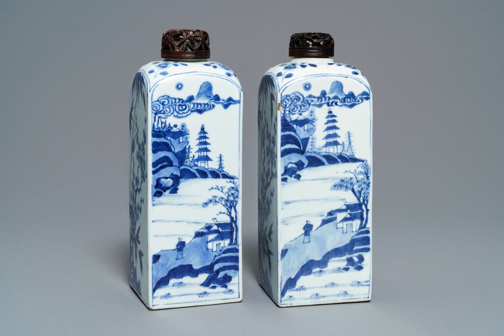 A pair of Chinese blue and white square tea caddies with landscapes and flowers, Kangxi