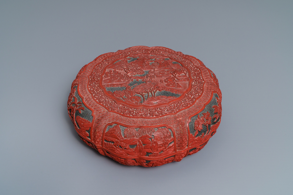 A Chinese cinnabar lacquer box and cover with figures in a landscape, 19th C.