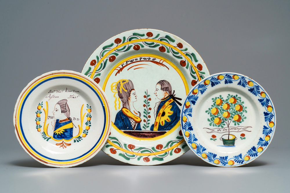 Two polychrome Dutch Delft 'orangist' plates and a dish, 18th C.