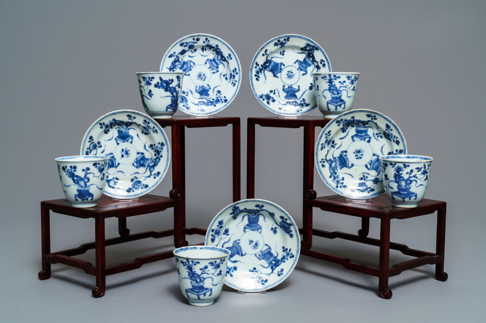 Five Chinese blue and white floral cups and saucers, Kangxi
