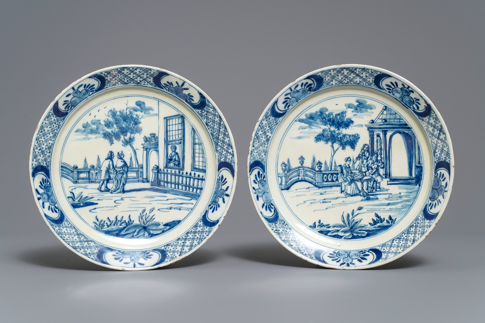 A pair of fine Dutch Delft blue and white 'garden scene' plates, 18th C.