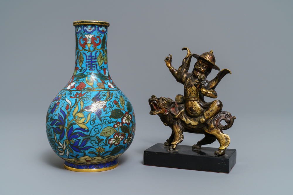 A Chinese cloisonn&eacute; bottle vase and a gilt bronze group, 18/19th C.