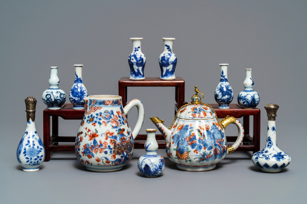 Nine Chinese blue and white miniature vases, an 'Amsterdams bont' teapot and a milk jug, Kangxi and later
