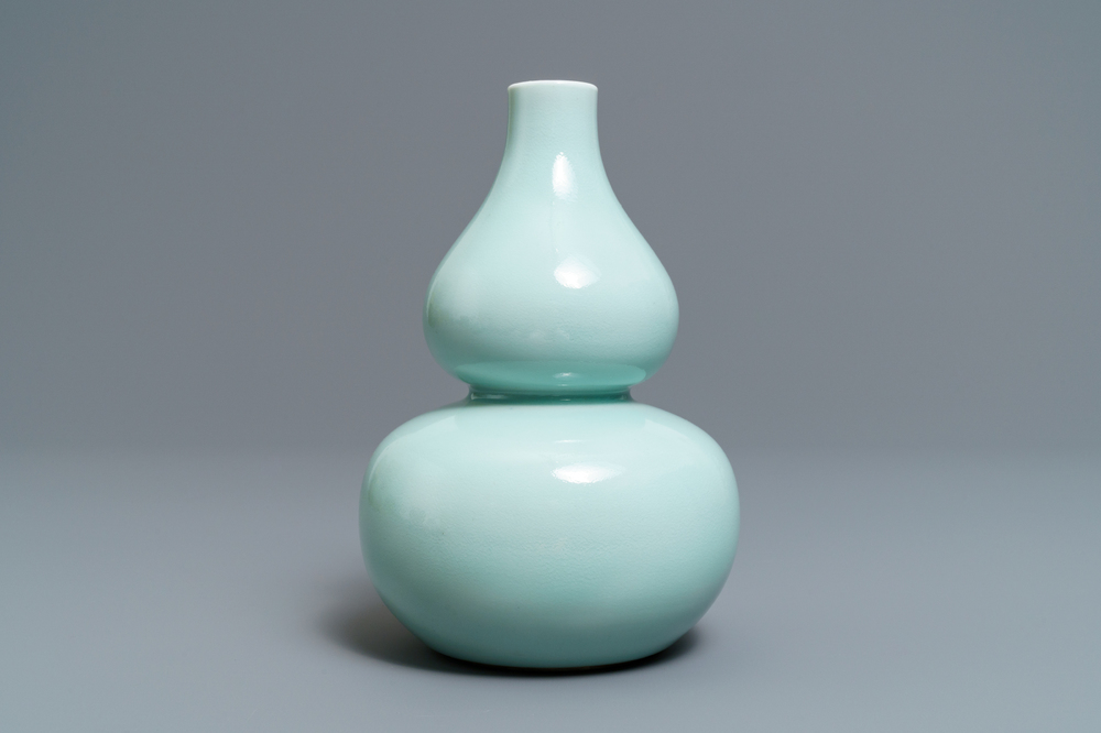 A Chinese monochrome celadon double gourd vase, Qianlong mark, 19th C.