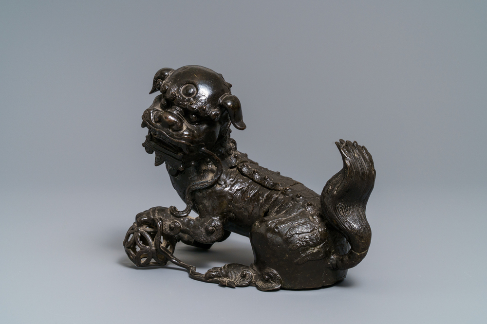 A Chinese bronze model of a Buddhist lion, Ming