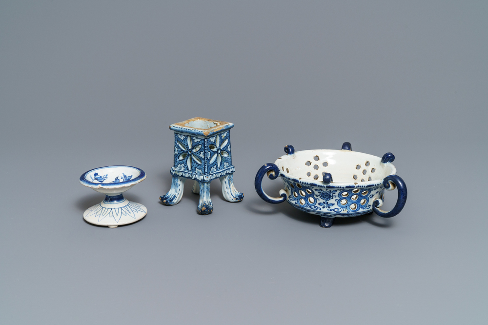 A Dutch Delft blue and white salt, a reticulated stand and a chafing dish, 18th C.