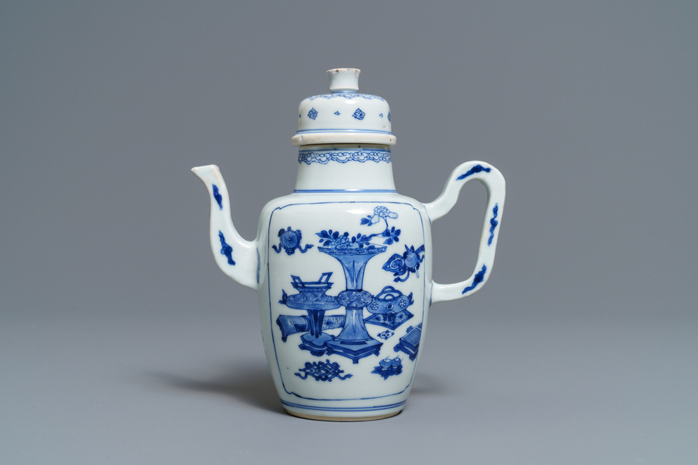 A Chinese blue and white wine jug and cover with antiquities, Kangxi