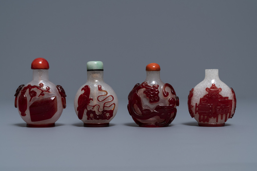 Four Chinese red overlay snowflake glass snuff bottles, 18/20th C.
