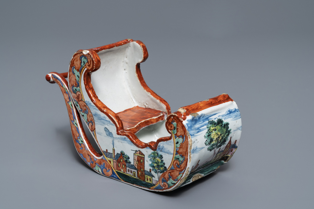 A polychrome petit feu Dutch Delft pipe stand modelled as a sledge, 18th C.