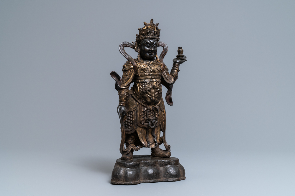 A Chinese gilt-lacquered bronze figure of Weituo, Ming