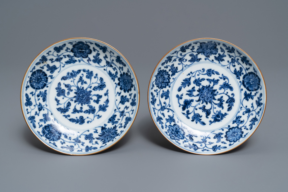 A pair of Chinese blue and white 'flower scroll' plates, Qianlong mark and of the period