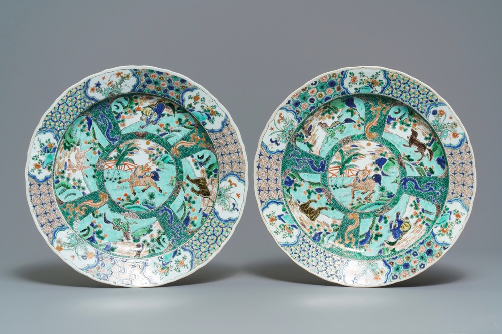A pair of Chinese famille verte 'mythical beasts' chargers, Kangxi