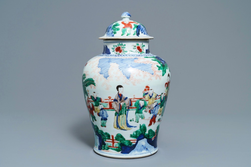 A Chinese wucai vase and cover with figures in a garden, seal mark, Transitional period