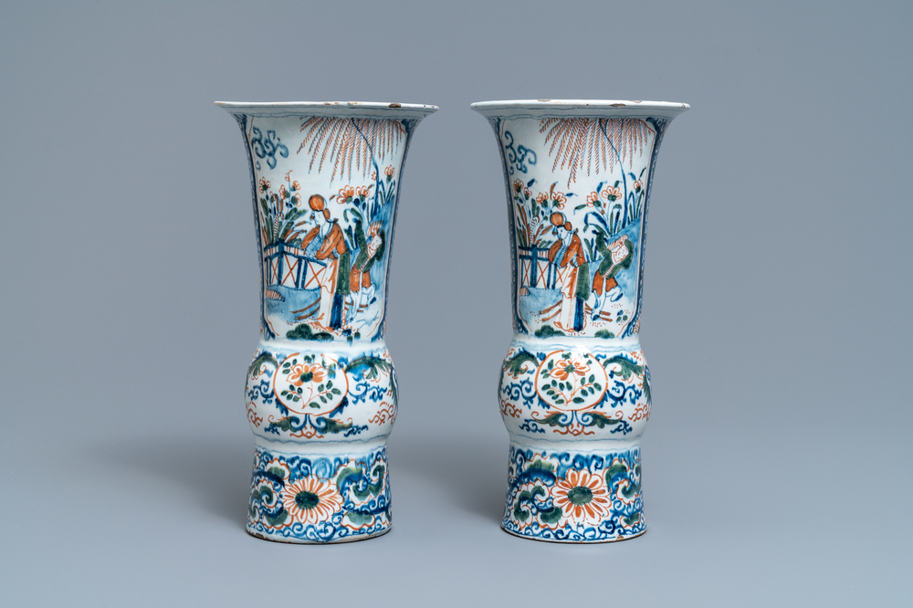 A pair of polychrome Dutch Delft chinoiserie beaker vases, 18th C.