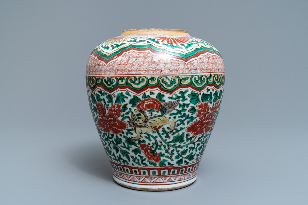 A Chinese wucai vase with buddhist lions and peonies, Transitional period