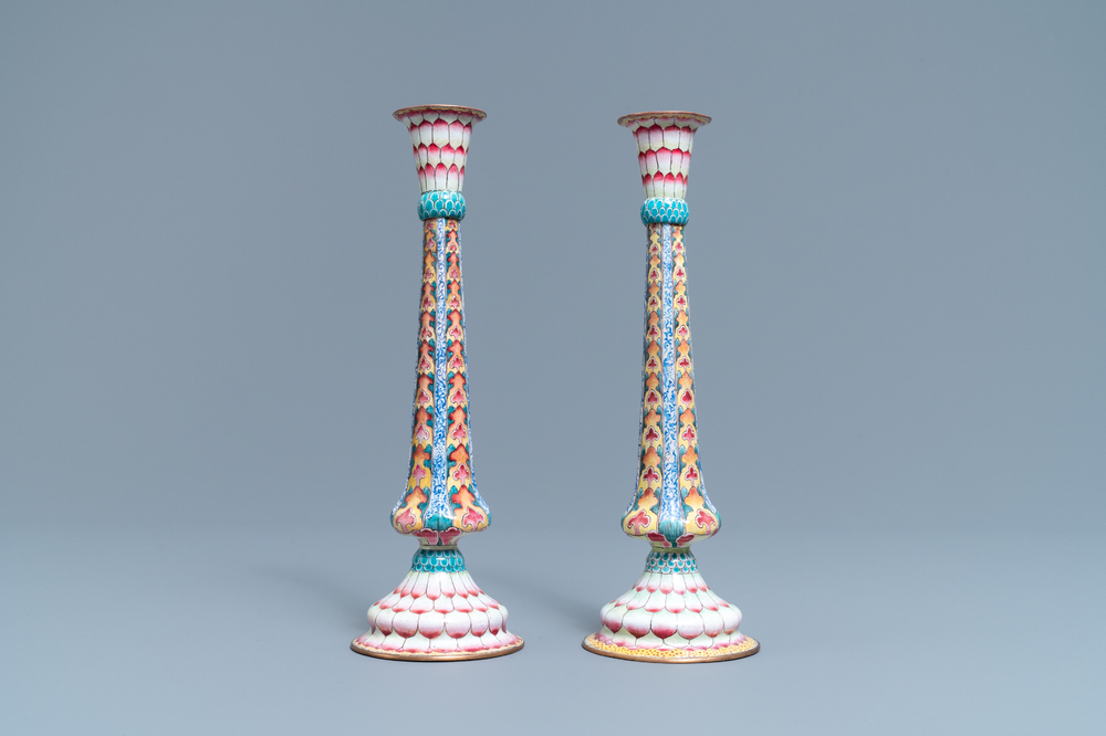 A pair of Chinese Canton enamel candlesticks with floral design, Yongzheng