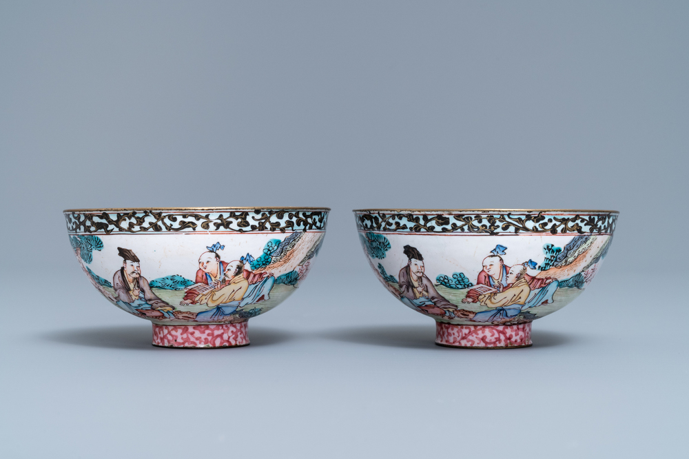 A pair of Chinese Canton enamel bowls with figures in a landscape, Yongzheng/Qianlong