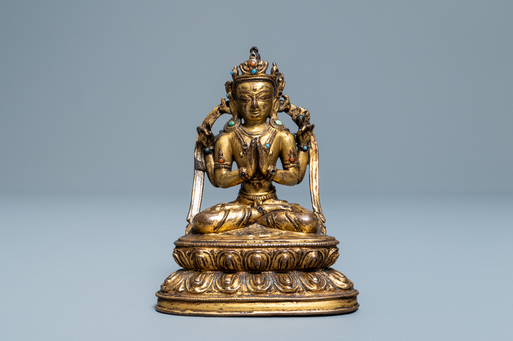 A Sino-Tibetan inlaid gilt bronze figure of Buddha, Ming