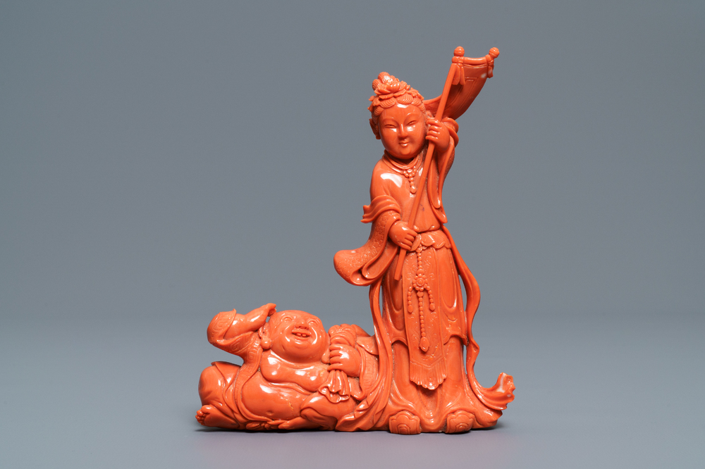 A Chinese carved coral group with a laughing Buddha, Republic, 20th C.