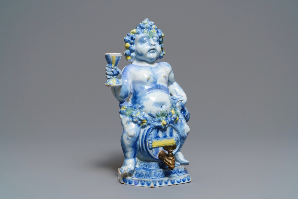 A polychrome Brussels faience 'Bacchus on a wine barrel' table fountain, 18th C.