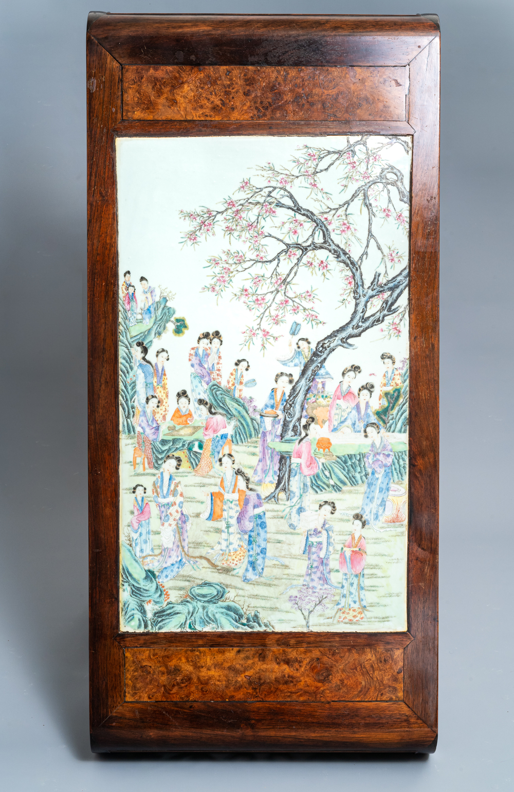 A large Chinese famille rose plaque inset in a wooden table, Republic, 20th C.