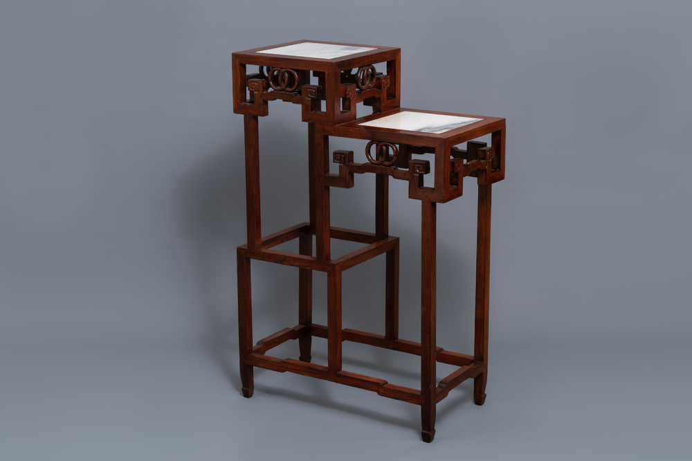 A double Chinese wooden display stand with marble tops, 19/20th C.