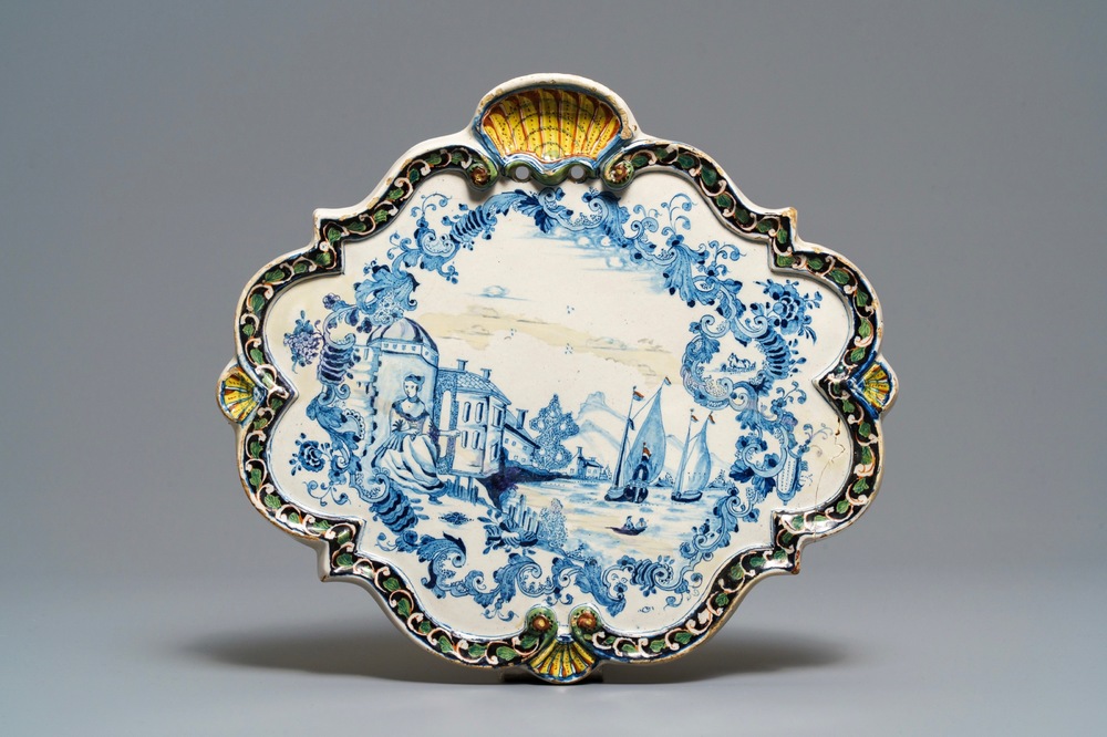 A polychrome Dutch Delft plaque with ships at sea, 18th C.