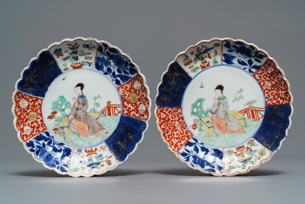 A pair of Chinese verte-Imari plates with a lady in a garden, Kangxi
