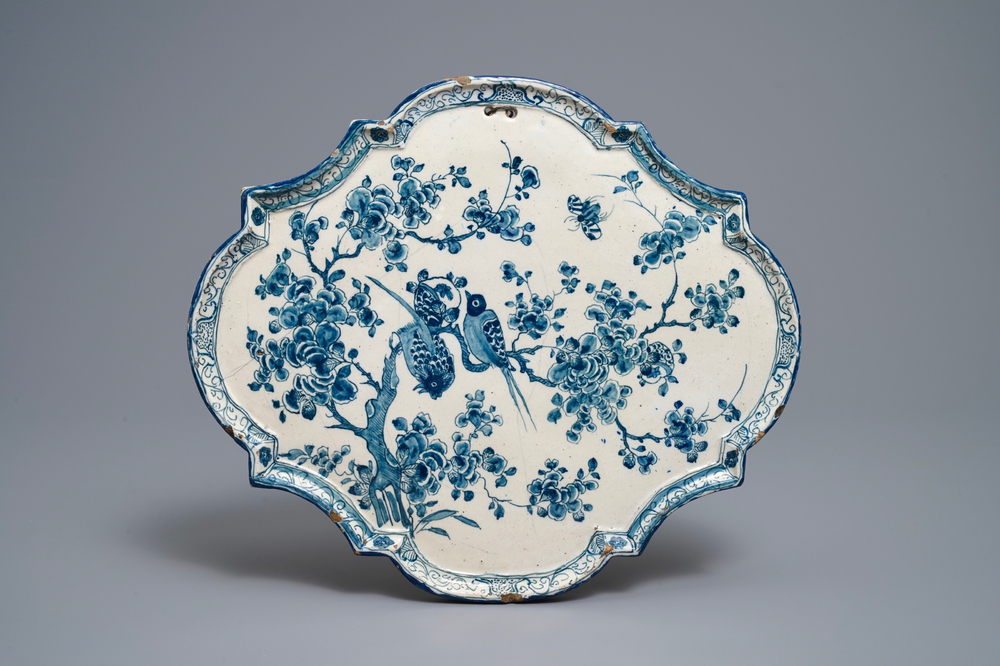 A Dutch Delft blue and white plaque with birds on flowery branches, 18th C.