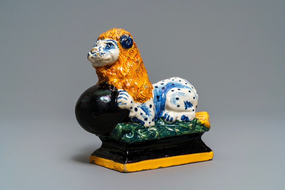 A black-enhanced polychrome Dutch Delft model of a lion, 1st half 18th C.