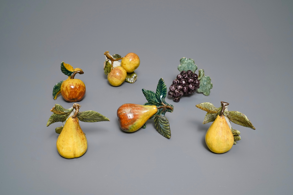 Six polychrome Dutch Delft models of apples, grapes and pears, 18th C.