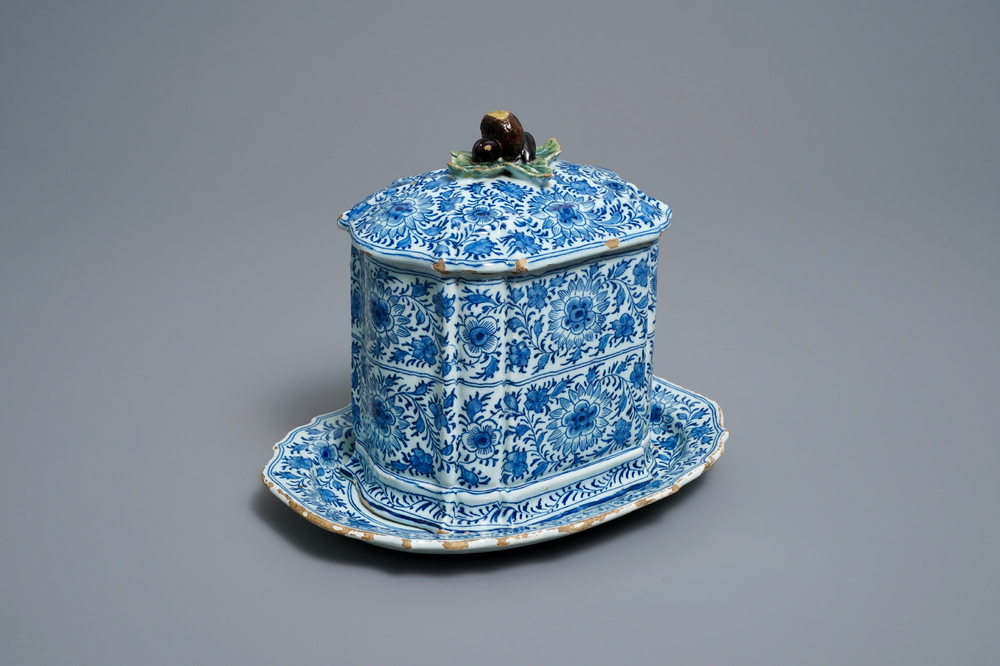 A rare Dutch Delft blue and white covered box with polychrome chestnut finial, 18th C.